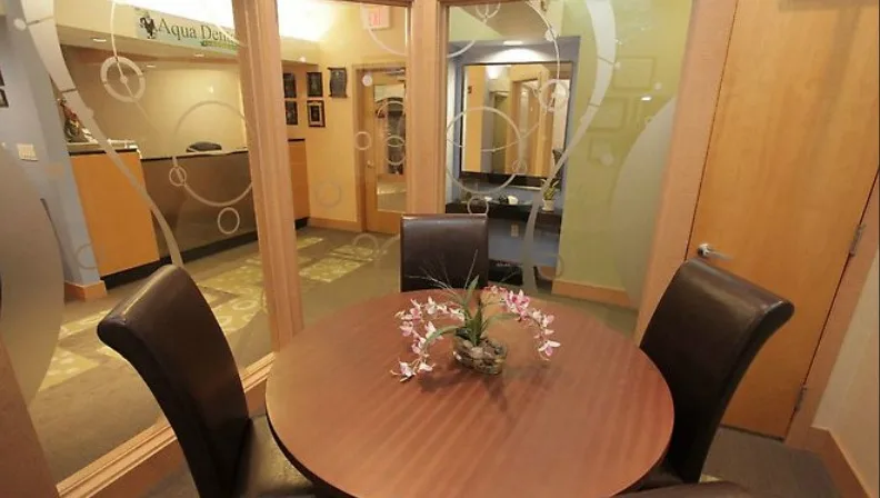 Consultation table behind frosted glass at Aqua Dental
